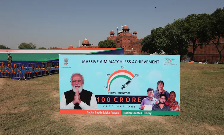 A sign celebrating India administering one billion COVID vaccine doses domestically