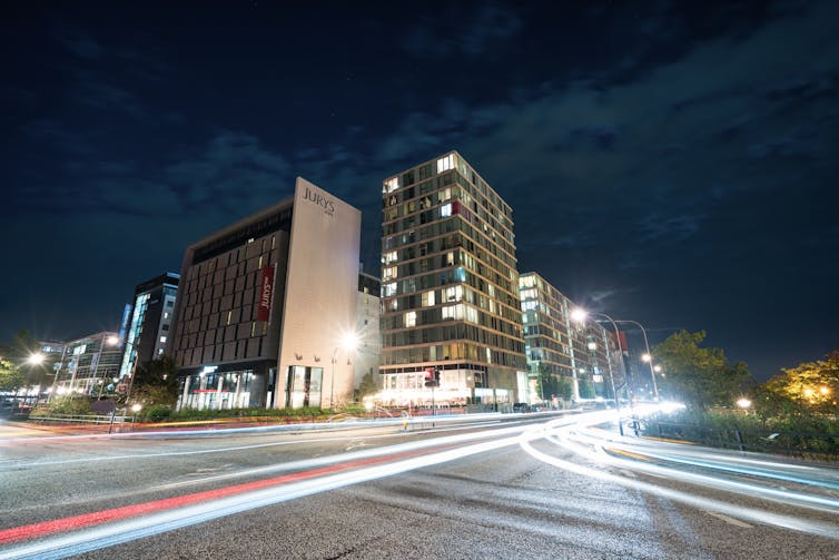 Nighttime shot of traffic and buildings in central Milton Keynes