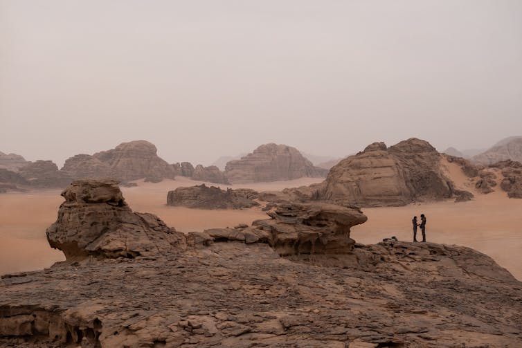 Sandy desert with large rocks