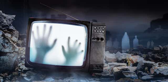 Spooky hands on TV screen.