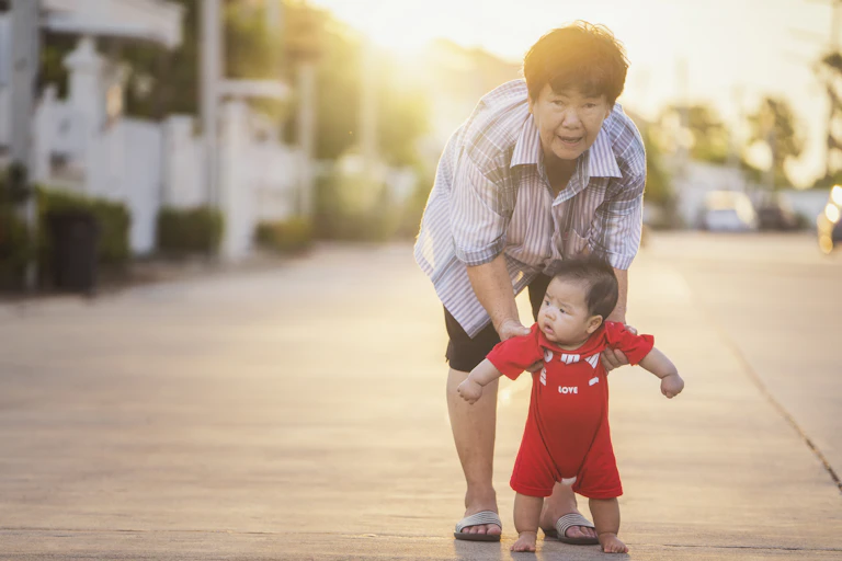 Grandmother with young baby.
