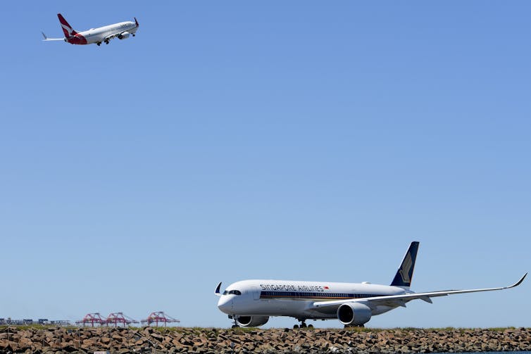 Passenger planes taking off and landing.