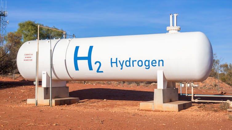 white tank with H2 Hydrogen in blue writing