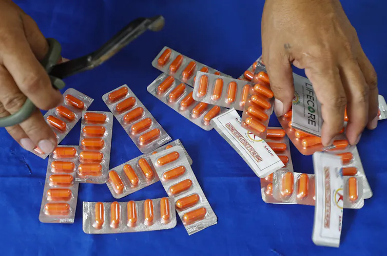A person selling ivermectin tablets on the street in the Philippines