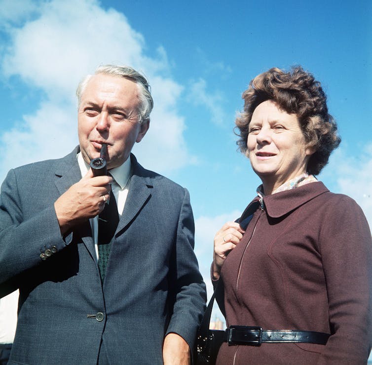 Harold Wilson smoking a pipe, and his wife Mary.