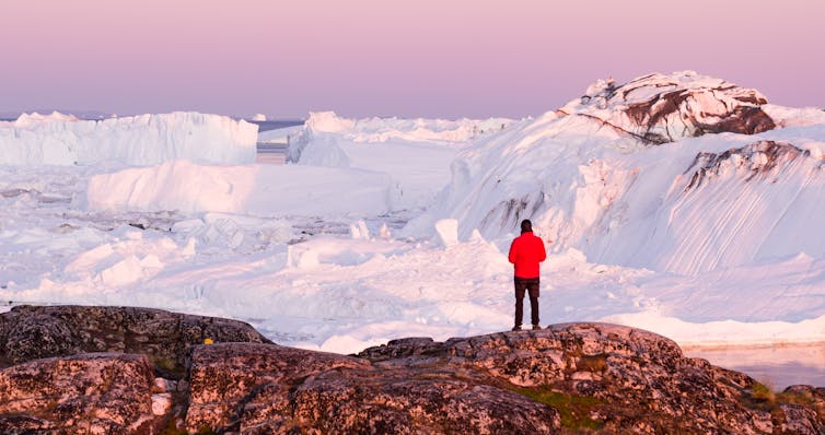 Climate Change Misinformation Fools Too Many People – But There Are Ways To Combat It 42 A Scientist In Red Jacket Stands Before A Glacier In Greenland.