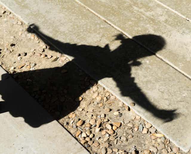 Child's shadow on the ground