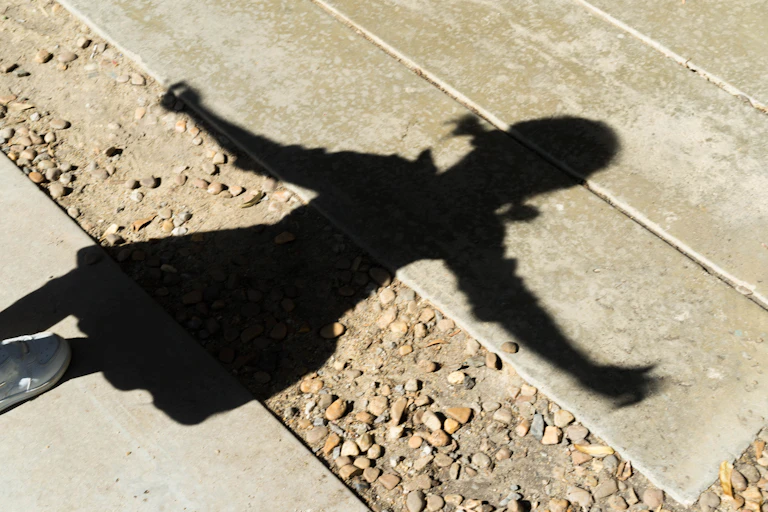 Child's shadow on the ground