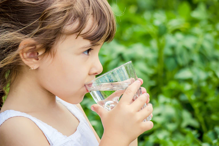 Girl drinking glass of water