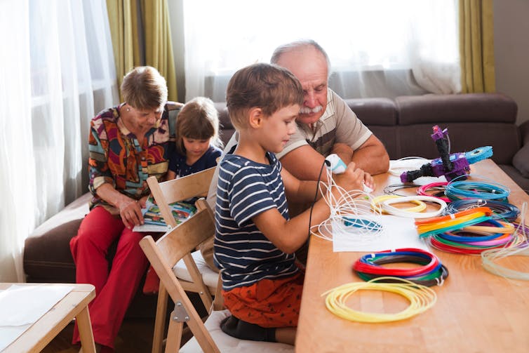 Grandparents playing with grandkids.