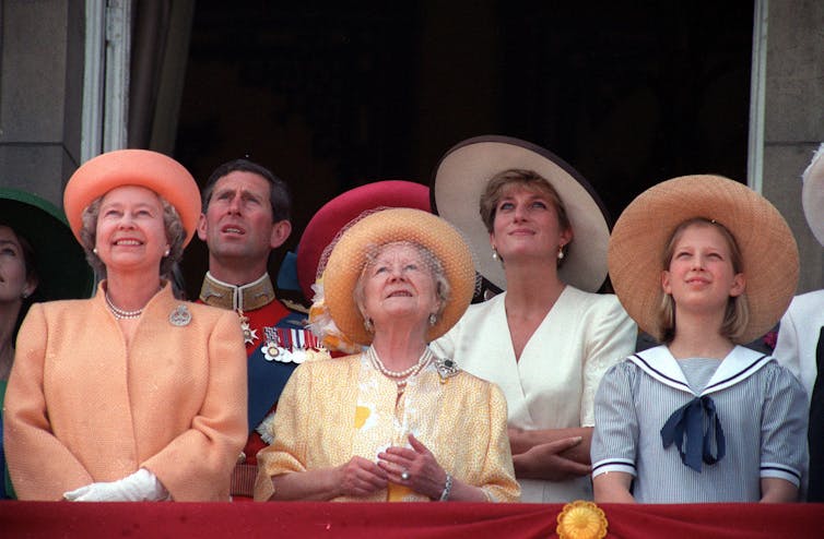 The Queen, Prince of Wales, Queen Mother, Princess of Wales and Lady Gabriella Windsor look up from Buckingham Palace balcony.