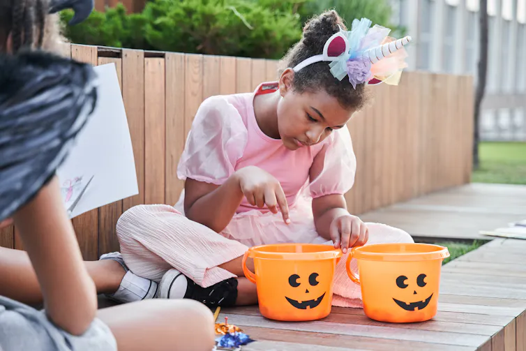 A girl looks through her candy.