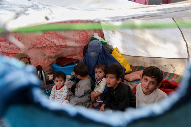 Afghan kids in a tent in Kabul.