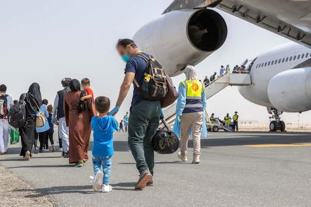 Afghan refugees arrive in Australia in August. 