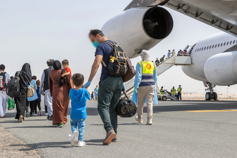 Afghan refugees arrive in Australia in August.