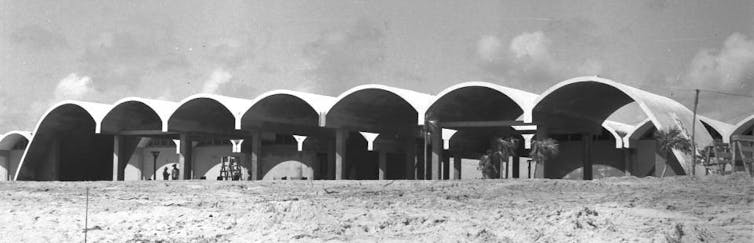 Vaulted homes lined up side by side.