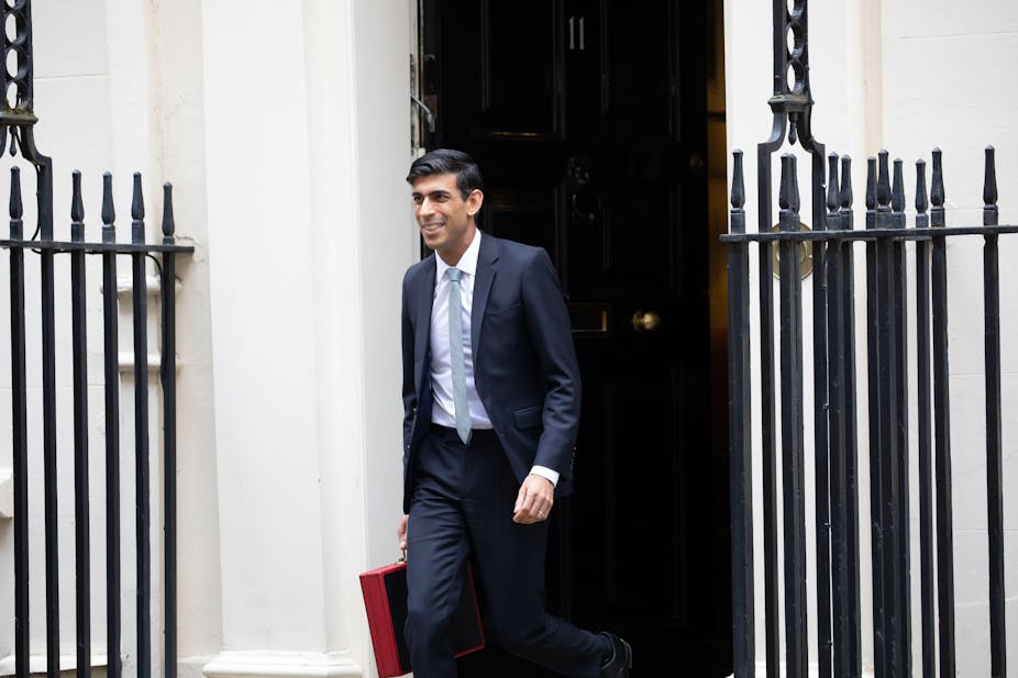 Rishi Sunak coming out of 11 Downing Street with the red briefcase