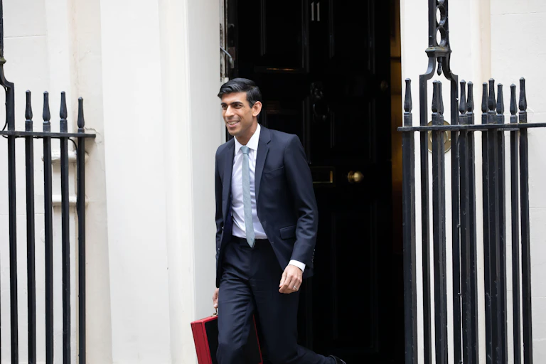 Rishi Sunak coming out of 11 Downing Street with the red briefcase