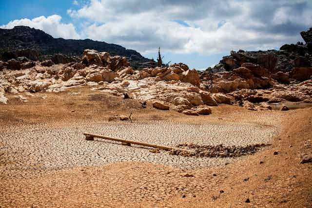 A dried out dam is pictured on a farm in Piket Bo-berg, Piketberg, north of Cape Town, on March 7, 2018 as a result of a three-year-long drought. 