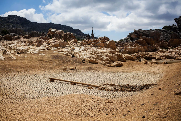 A dried out dam is pictured on a farm in Piket Bo-berg, Piketberg, north of Cape Town, on March 7, 2018 as a result of a three-year-long drought.