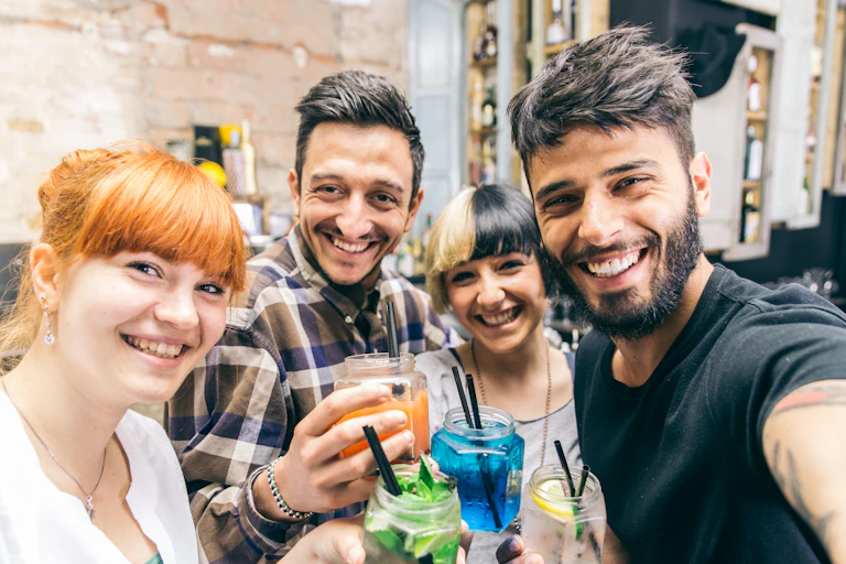 Young people drinking in a bar.