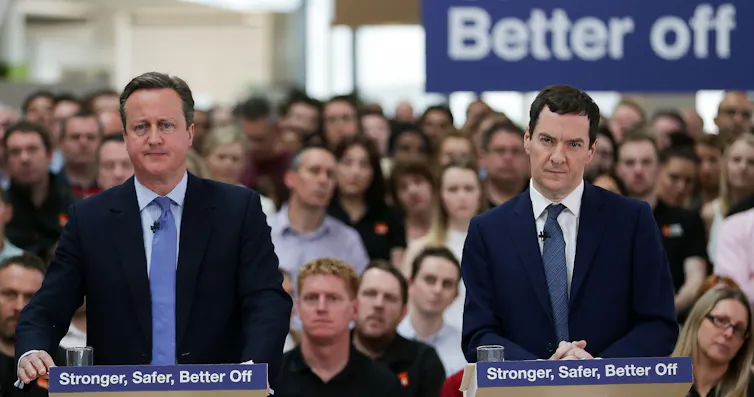 David Cameron and George Osborne giving a speech.