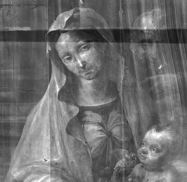 X-ray image of painting of woman and man.