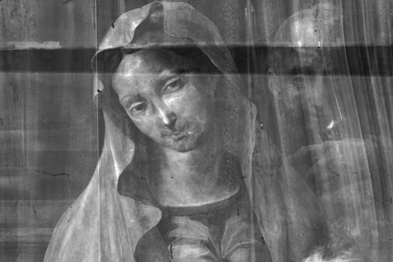 X-ray image of painting of woman and man.