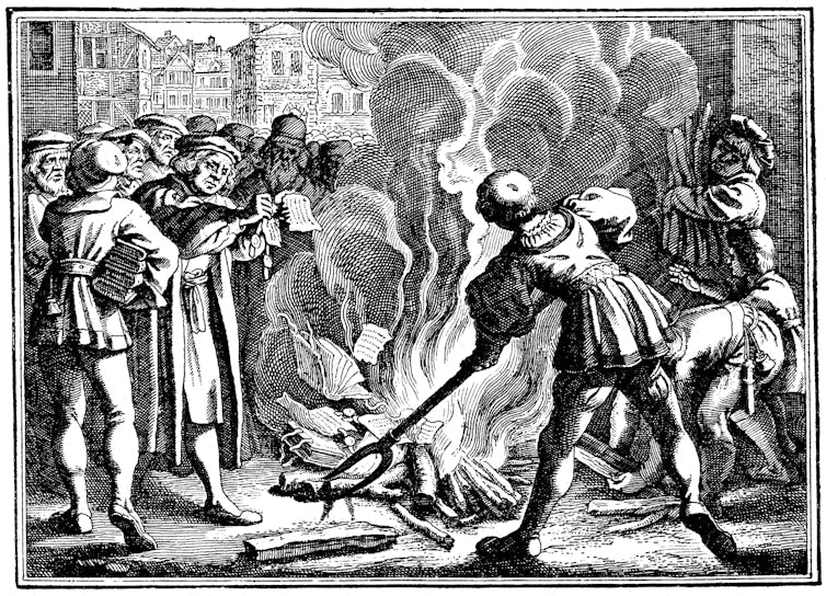 A crowd stands around a flame as a man burns papers in this black and white drawing.