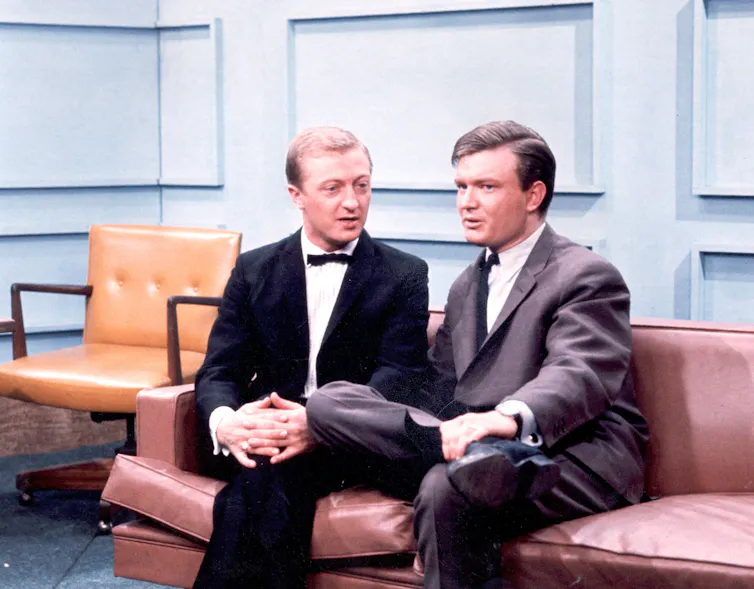 Two men on a leather couch