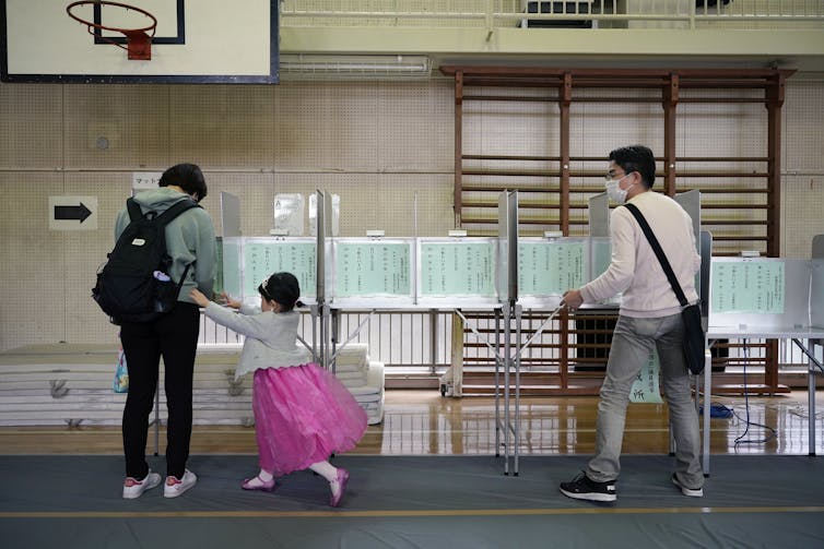 A Japanese family cast their votes.