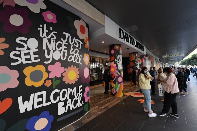 Shoppers returning to a David Jones store in Melbourne