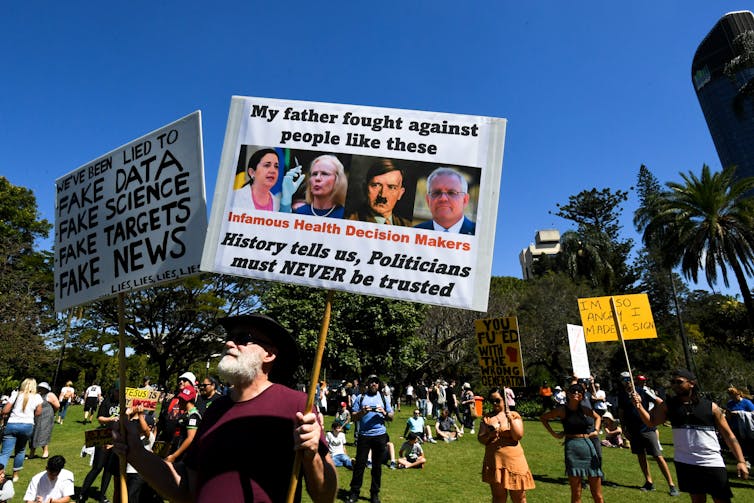 Protesters express opposition to lockdowns, COVID-19 tests, mask mandates and vaccine mandates at the Botanic Gardens in Brisbane, August 21 2021.