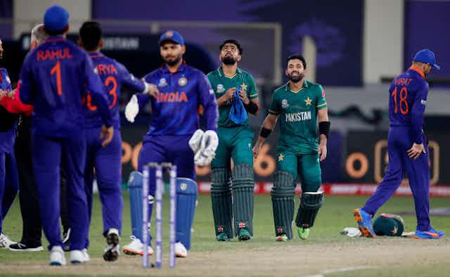 Cricket players from India and Pakistan after the recent clash in the T20 World Cup in Dubai, October 2021.