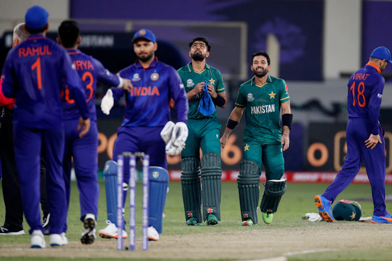 Cricket players from India and Pakistan after the recent clash in the T20 World Cup in Dubai, October 2021.