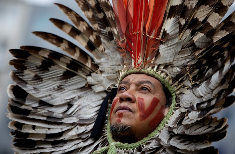 man in traditional Brazilian head-dress