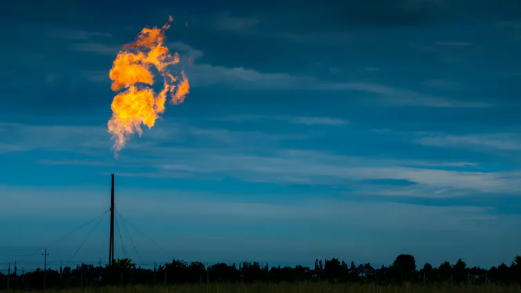 A flame rising above a gas distribution site.