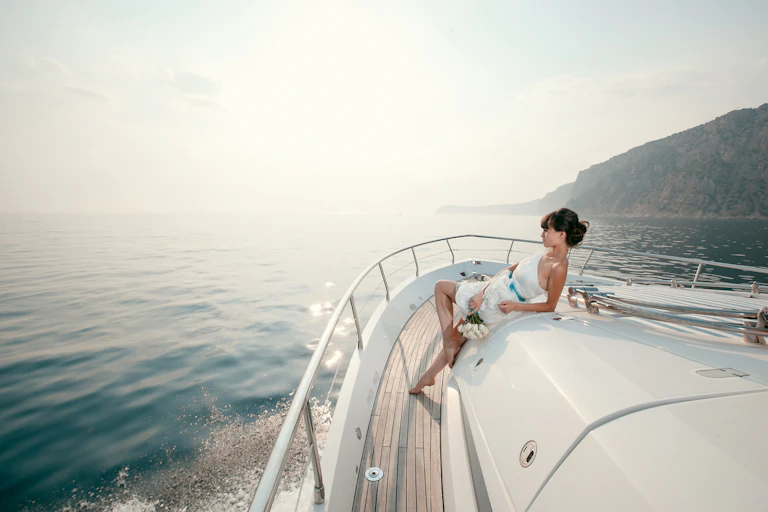 Woman lounging on luxury yacht.