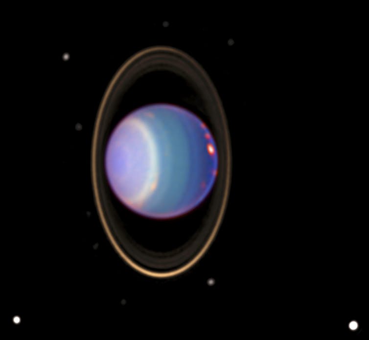 Image showing blue and purple planet with rings