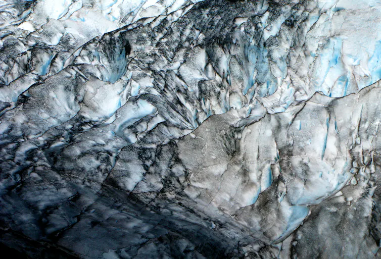 Glacier ice streaked with soot