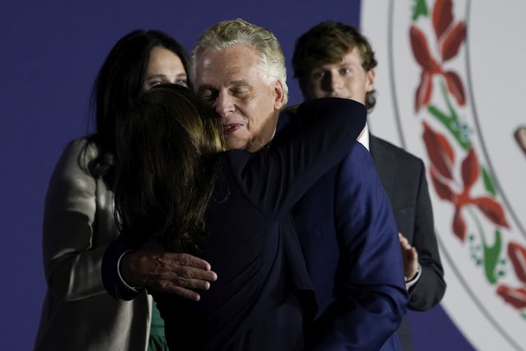 Terry McAuliffe, the Democratic gubernatorial candidate and former Virginia governor who lost to Republican Glenn Youngkin, hugs his wife, Dorothy, on election night.