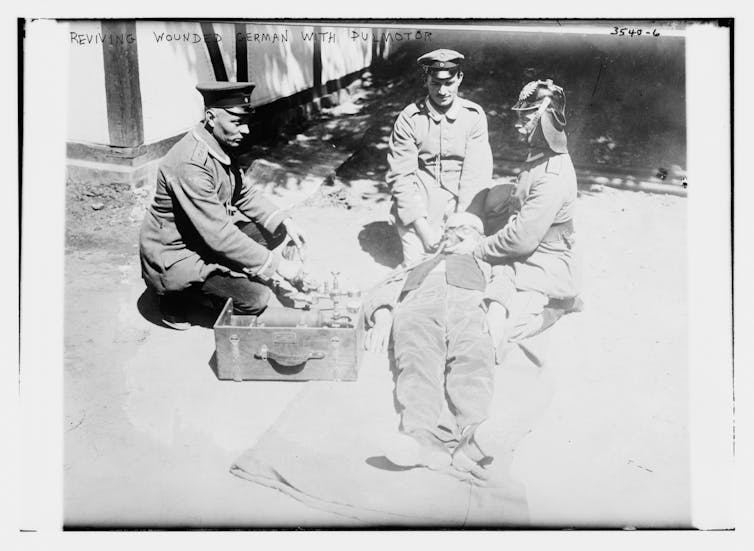 A German man being revived with a pulmotor.