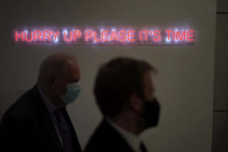 The illuminated words "Hurry up please it's time" are displayed at the COP26 U.N. Climate Summit, in Glasgow, Scotland,