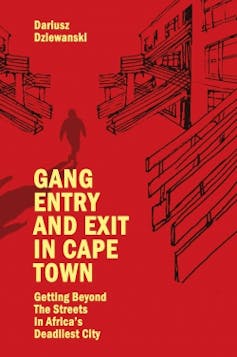 A book cover with yellow writing - Gang entry and exit in Cape Town - and a red graphic of urban housing and a male figure walking.