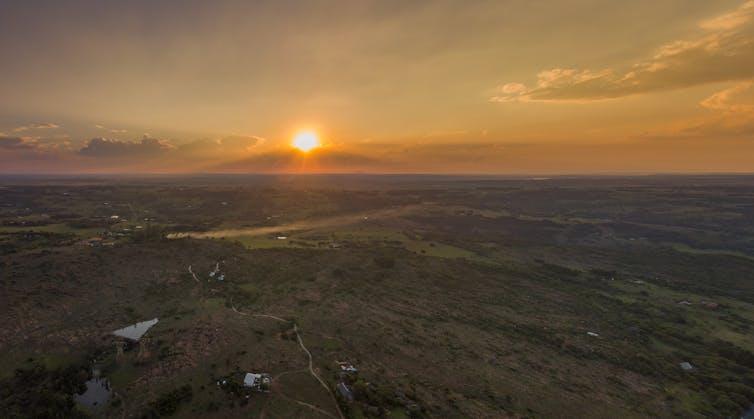 Aerial view of farmland east of Pretoria, South Africa, where the novel is set. Salt Rock Digital/Shutterstock Farm land and a sunset.