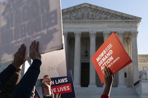 Supreme Court appears to suggest right to guns at home extends to carrying them in public too