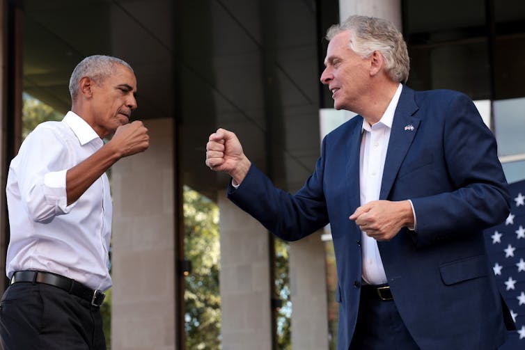 Former U.S. President Barack Obama fist-bumping Democratic gubernatorial candidate, former Virginia Gov. Terry McAuliffe
