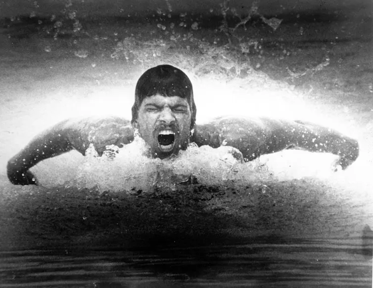 Man coming up for air while swimming.