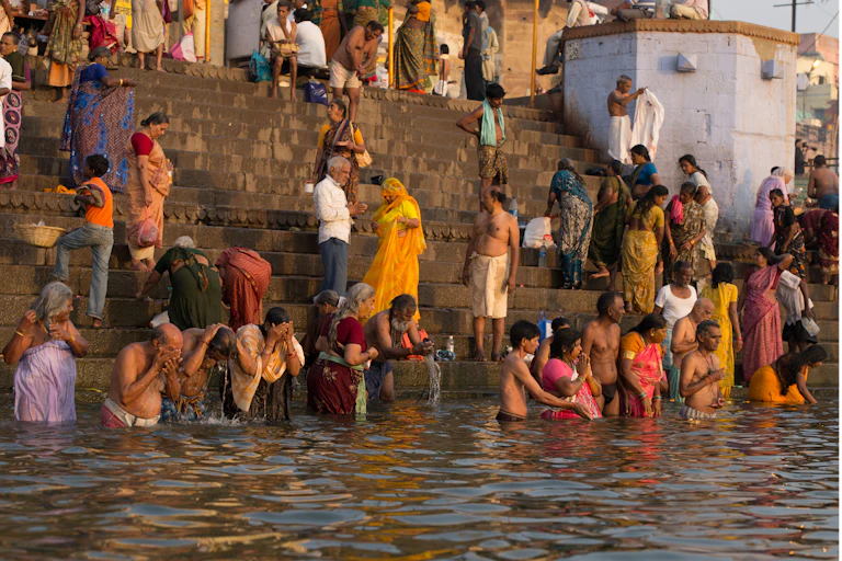 Bathing and Purification in the Ganges River at dawn - Varanasi, India. Studies have reported high pollution - fecal Stock Photo Download preview Save to lightbox Add to cart Share Bathing and Purification in the People bathing in the Ganges River, India