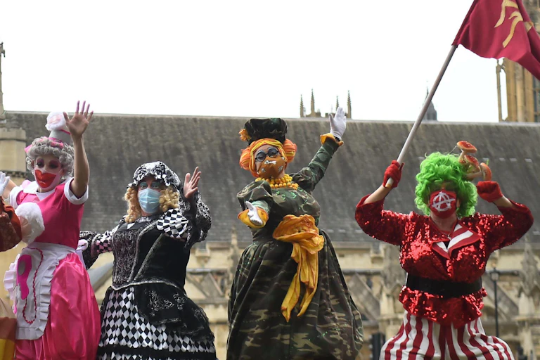 Actors jumping around in costumes